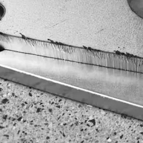 Laser cut part after deburring with uniform surface finish